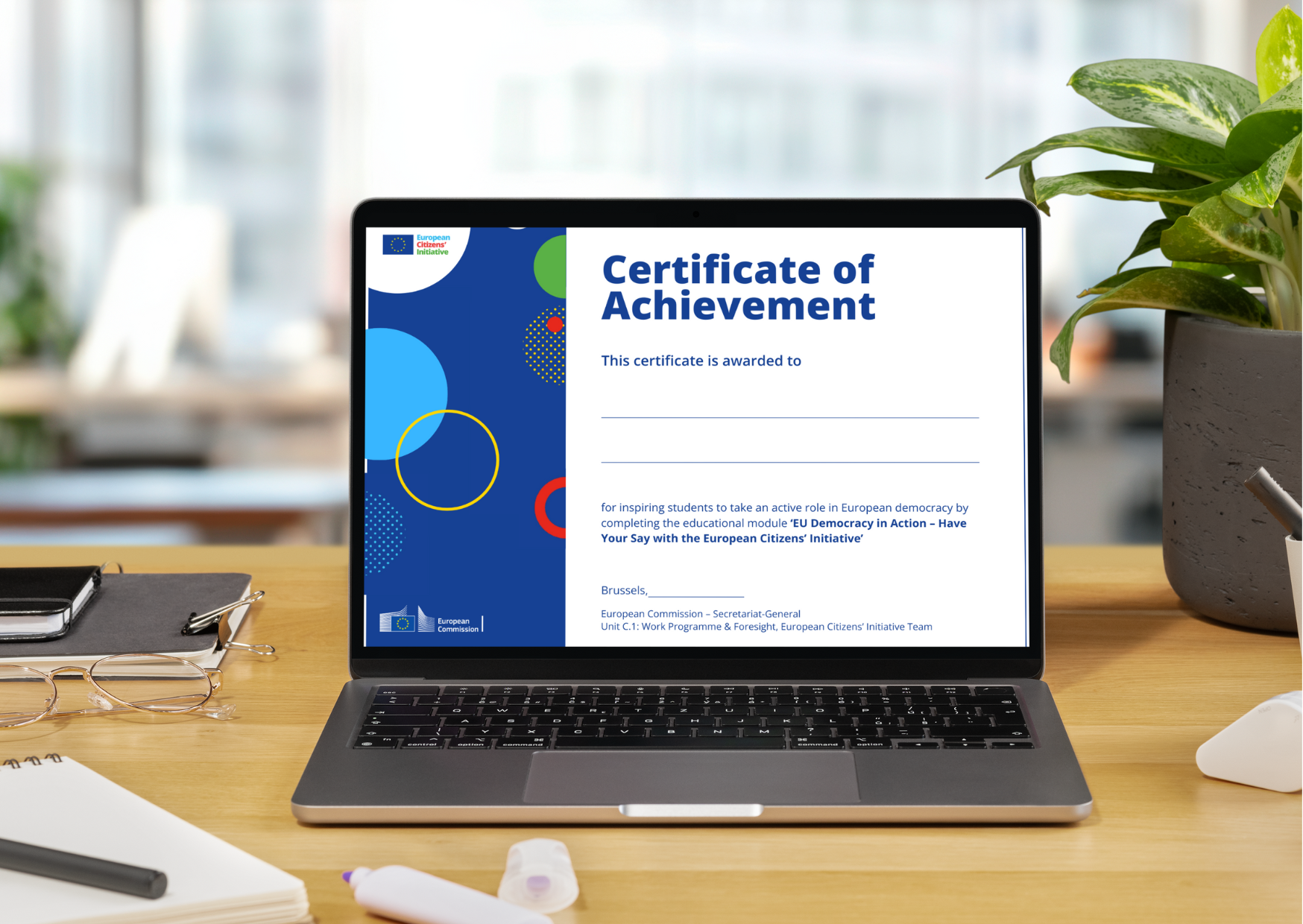 Laptop on a table portraying certificate of achievement