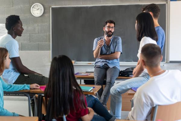 Teacher and students discussing in a classroom