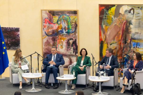 5 people seating in a panel. names in the news