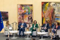 5 people seating in a panel. names in the news